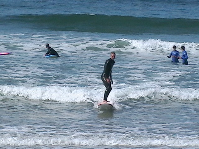 catching foam surfing waves