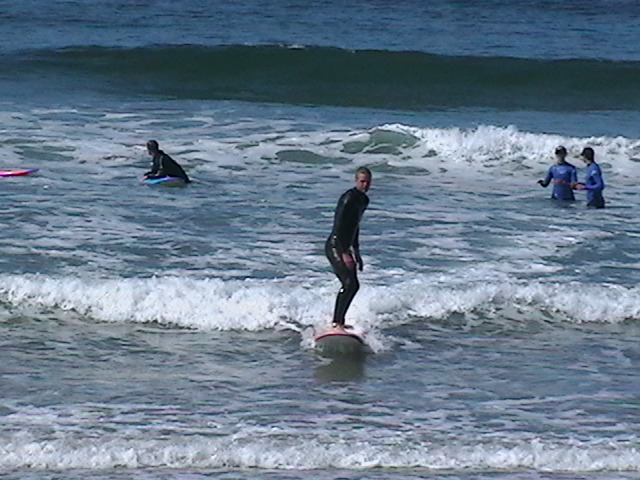 surfers ride foam waves on softtop boards