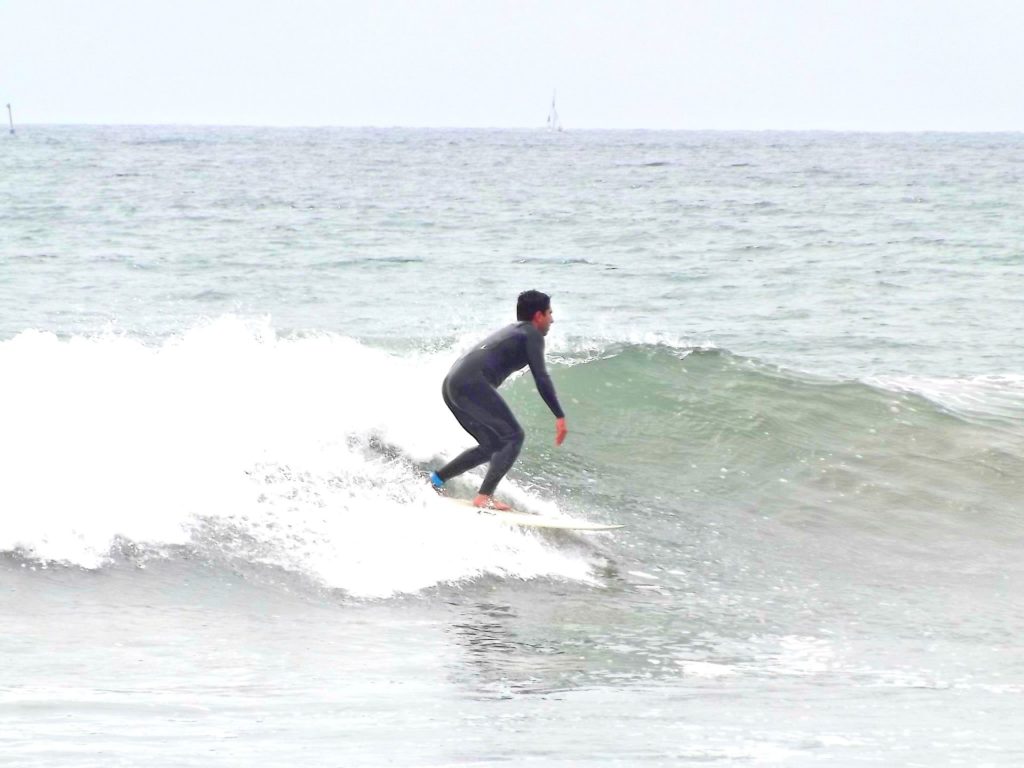 the beginner surfer makes progress in Oceanside